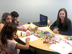 Ekaterina Evdokimova (far right) teaching the nuances of the Russian language to three young students by using art at her new Encino business 2Belingual Language School