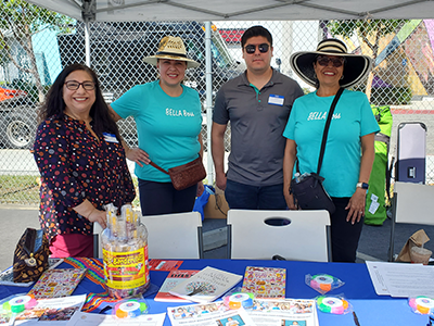 Pictured with Bella Entrepreneurs staff, East LA BusinessSource Program Director Irma Vargas (pictured far left), and Pico-Union BSC Business/Loan Counselor Ivan Vasquez (pictured second from right)