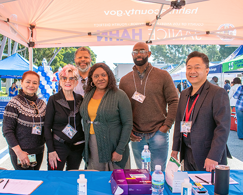 EWDD General Manager Carolyn Hull (center) poses with Harbor WorkSource Center staff at the Harbor Regional Connect-LA Job Fair in early March 2023