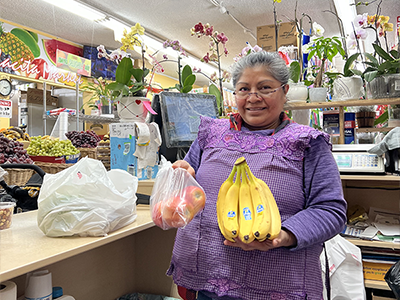 Emiliana Lopez, mother of La Placita Market owner Ricardo Lopez, proudly shows off healthy food offerings at their Pico-Union community market