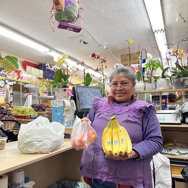 Emiliana Lopez, mother of La Placita Market owner Ricardo Lopez, proudly shows off healthy food offerings at their Pico-Union community market