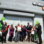 Councilmember Curren Price (sixth from right), EWDD General Manager Carolyn Hull (fifth from right), with CRCD staff and community members celebrate the opening of the new Southeast LA BusinessSource Center on Central Avenue
